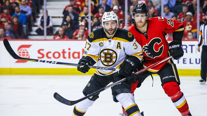 Boston Bruins forward Patrice Bergeron and Calgary Flames defenseman Dougie Hamilton