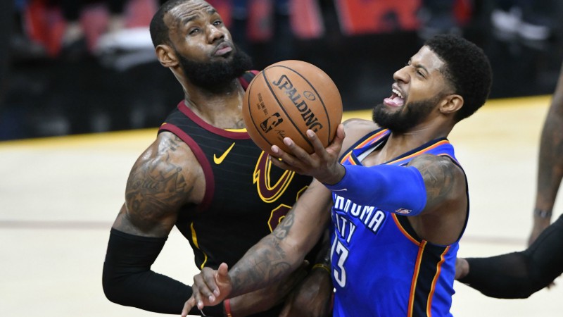 Oklahoma City Thunder forward Paul George and Cleveland Cavaliers forward LeBron James