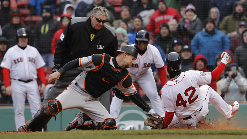 Boston Red Sox outfielder Andrew Benintendi and Baltimore Orioles catcher Caleb Joseph