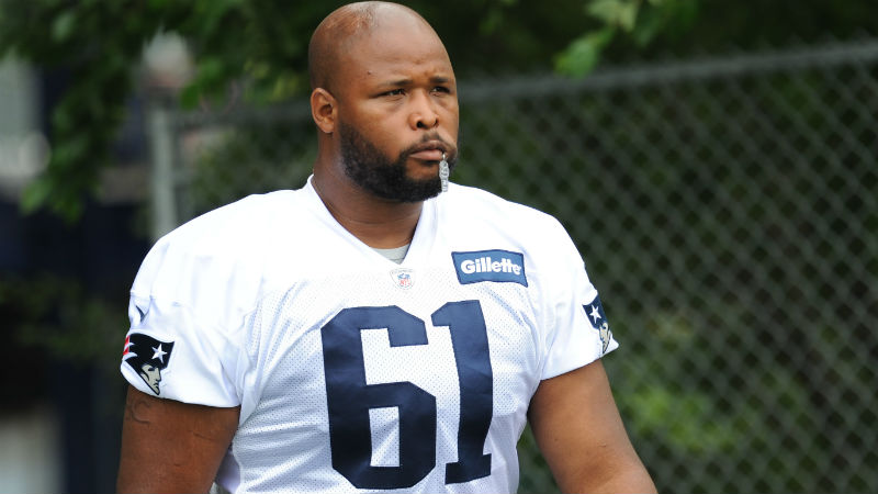 New England Patriots offensive lineman Marcus Cannon (61) walks to the practice