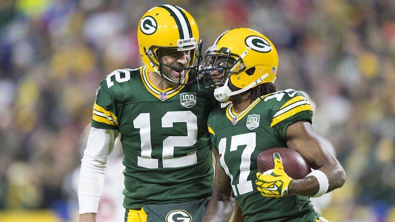 Green Bay Packers quarterback Tom Brady and wide receiver Davante Adams