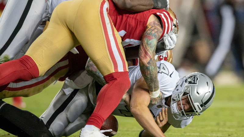 Oakland Raiders quarterback Derek Carr (4) and San Francisco 49ers defensive end Cassius Marsh