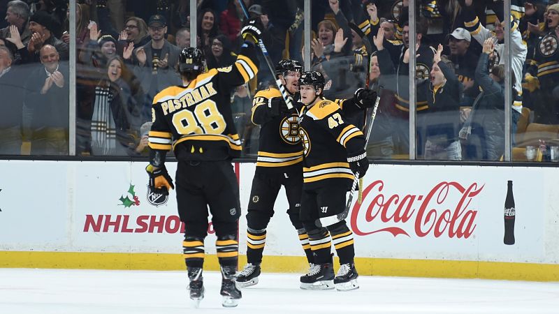 Boston Bruins wingers Joakim Nordstrom and David Pastrnak and defenseman Torey Krug