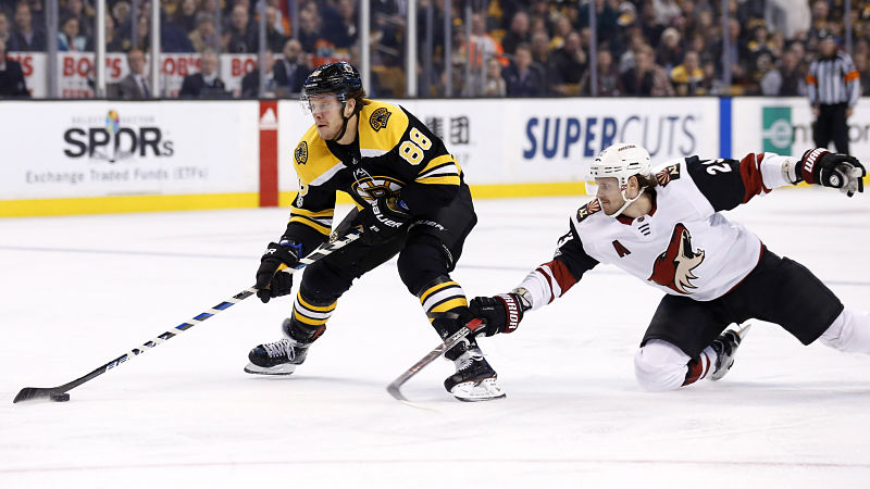 Boston Bruins forward David Pastrnak and Arizona Coyotes defenseman Oliver Ekman-Larsson