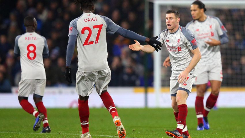 Liverpool forward Divock Origi (27) and midfielder James Milner