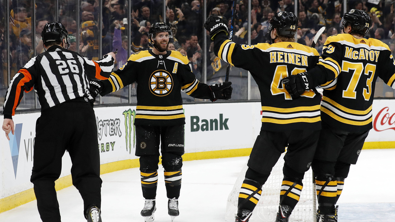 Boston Bruins' David Krejci, Danton Heinen, Charlie McAvoy