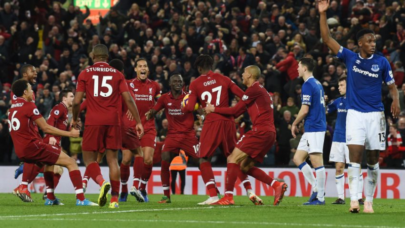 Liverpool FC's Divock Origi and teammates