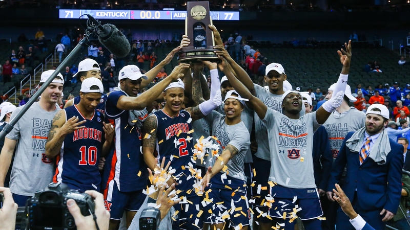 Auburn Basketball Lifts Final Four Trophy