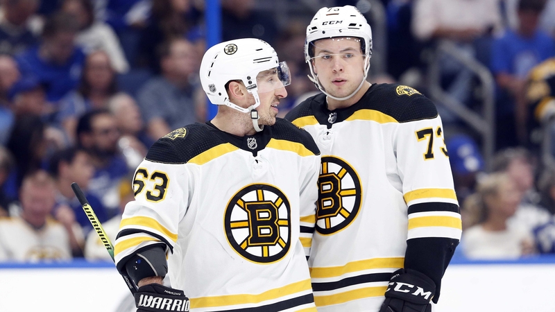 Boston Bruins Winger Brad Marchand And Defenseman Charlie McAvoy