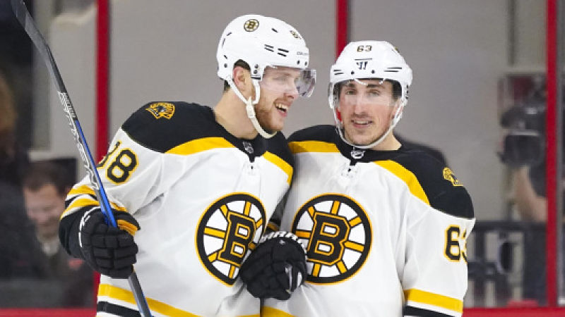 Boston Bruins forwards David Pastrnak, Brad Marchand