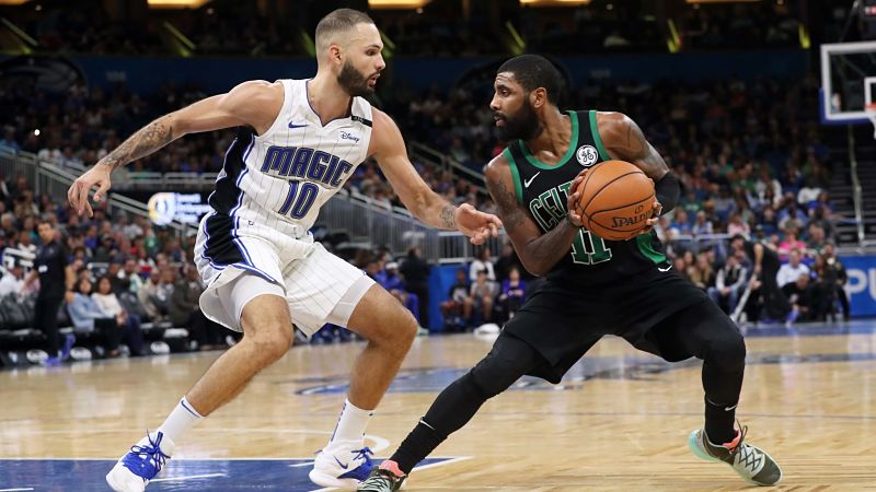 Boston Celtics guard Kyrie Irving and Orlando Magic guard Evan Fournier