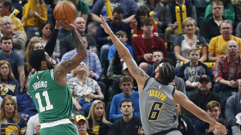 Boston Celtics guard Kyrie Irving and Indiana Pacers guard Cory Joseph
