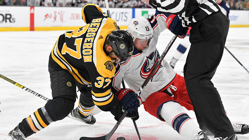 Boston Bruins' Patrice Bergeron And Columbus Blue Jackets' Cam Atkinson