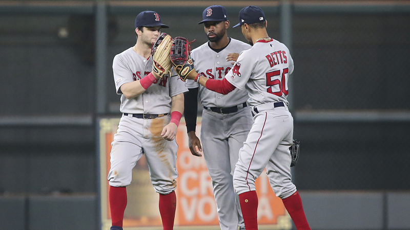 Boston Red Sox outfielders Andrew Benintendi, Jackie Bradley Jr. and Mookie Betts