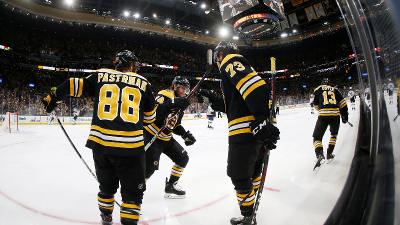 Boston Bruins' Charlie Coyle (13), David Pastrnak (88), Charlie McAvoy (73)
