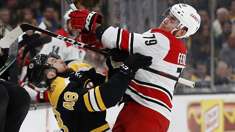 Boston Bruins defenseman Matt Grzelcyk; Carolina Hurricanes forward Micheal Ferland