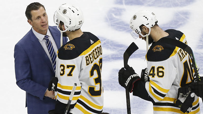 Carolina Hurricanes coach Rod Brind'Amour and Boston Bruins center Patrice Bergeron