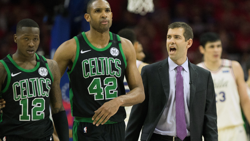 Boston Celtics guard Terry Rozier (12), forward Al Horford (42) and head coach Brad Stevens