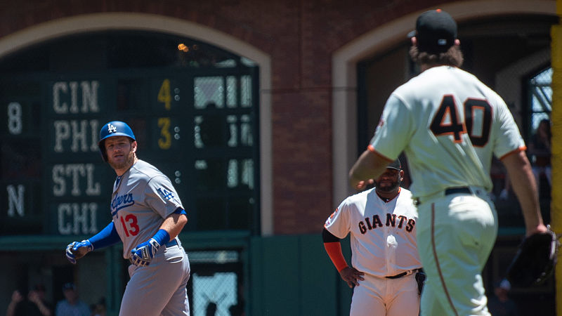 Los Angeles Dodgers second baseman Max Muncy, San Francisco Giants pitcher Madison Bumgarner