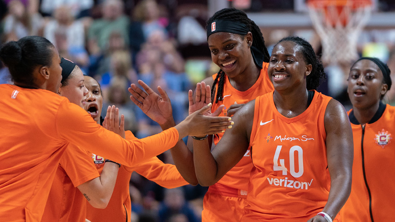 Connecticut Sun guard Shekinna Stricklen (right) and forward Jonquel Jones (center)