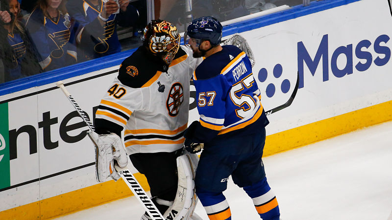 Boston Bruins goaltender Tuukka Rask, St. Louis Blues forward David Perron