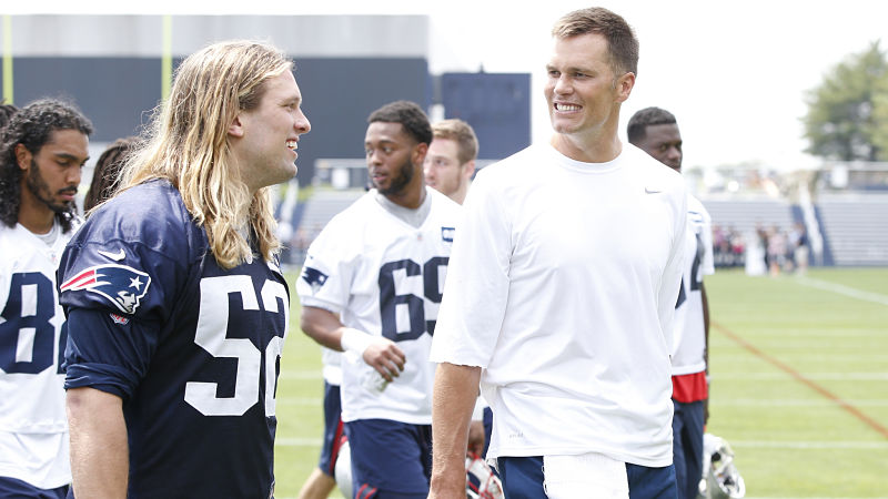 New England Patriots defensive lineman Chase Winovich and Tampa Bay Buccaneers quarterback Tom Brady