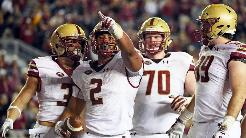 Boston College Eagles running back AJ Dillon (2) and teammates