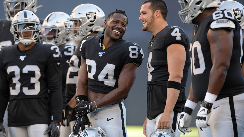 Oakland Raiders wide receiver Antonio Brown (84) and quarterback Derek Carr (4)