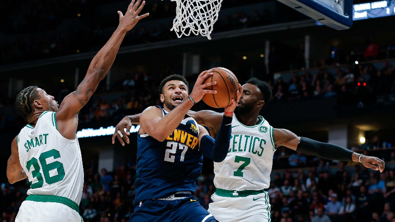 Boston Celtics guard Marcus Smart (36) and guard Jaylen Brown (7) and Denver Nuggets guard Jamal Murray (27)