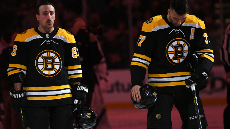 Boston Bruins left wing Brad Marchand (63) and center Patrice Bergeron (37)
