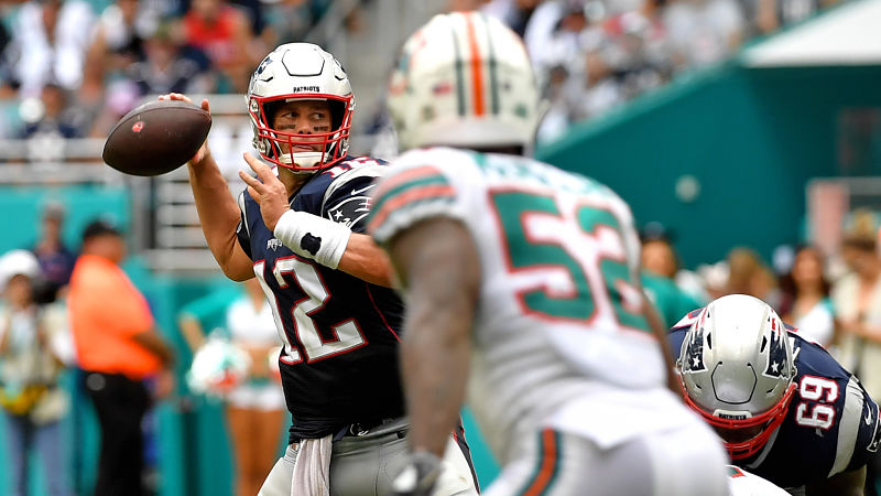 New England Patriots quarterback Tom Brady and Miami Dolphins linebacker Raekwon McMillan