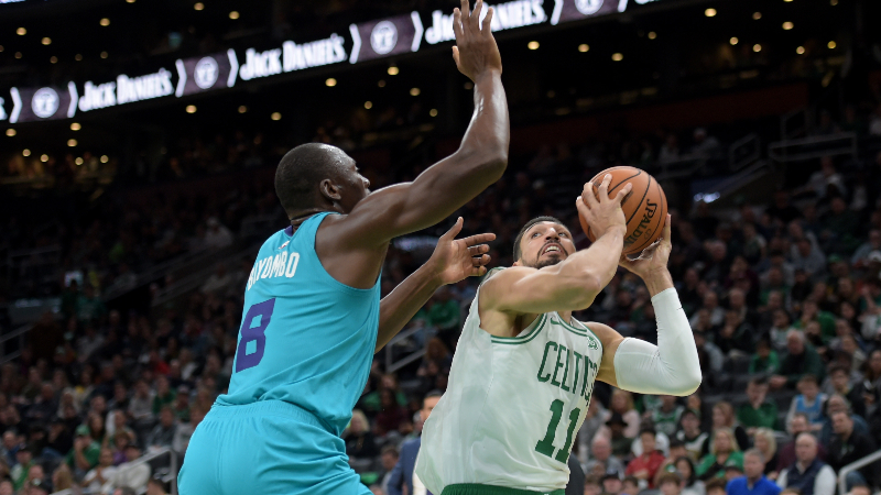 Boston Celtics center Enes Kanter (11) and Charlotte Hornets center Bismack Biyombo (8)