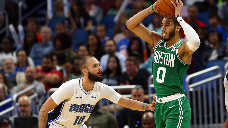 Boston Celtics forward Jayson Tatum (0) and Orlando Magic guard Evan Fournier (10)