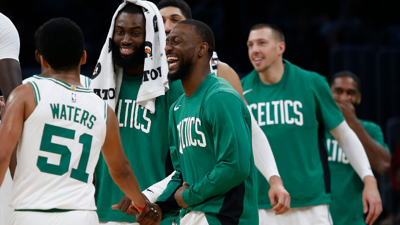Boston Celtics guards Tremont Waters (51) and Kemba Walker (center)