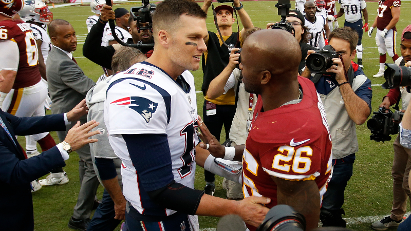 New England Patriots quarterback Tom Brady (12) and Washington Redskins running back Adrian Peterson (26)