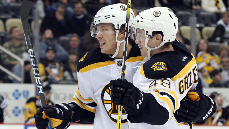 Boston Bruins' David Pastrnak And Matt Grzelcyk