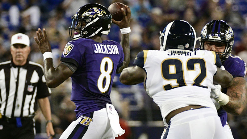 Baltimore Ravens quarterback Lamar Jackson and Los Angeles Rams defensive tackle Tanzel Smart