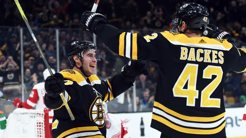 Bruins defenseman John Moore, forward David Backes