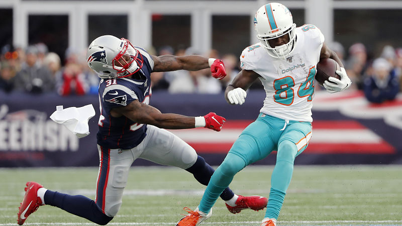 New England Patriots cornerback Jonathan Jones and Miami Dolphins wide receiver Isaiah Ford