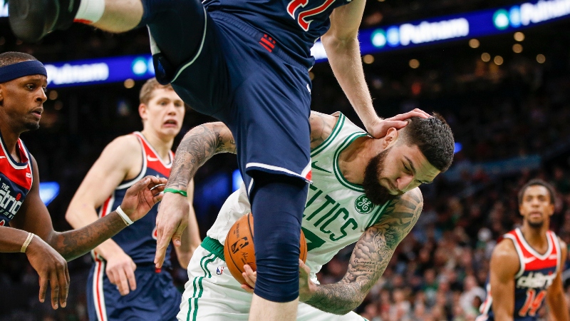 Boston Celtics center Vincent Poirier (77) and Washington Wizards center Davis Bertans (42)