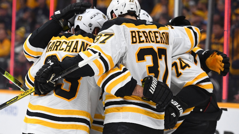 Boston Bruins center Patrice Bergeron (37), left wing Brad Marchand (63) and defenseman Jake DeBrusk (74)