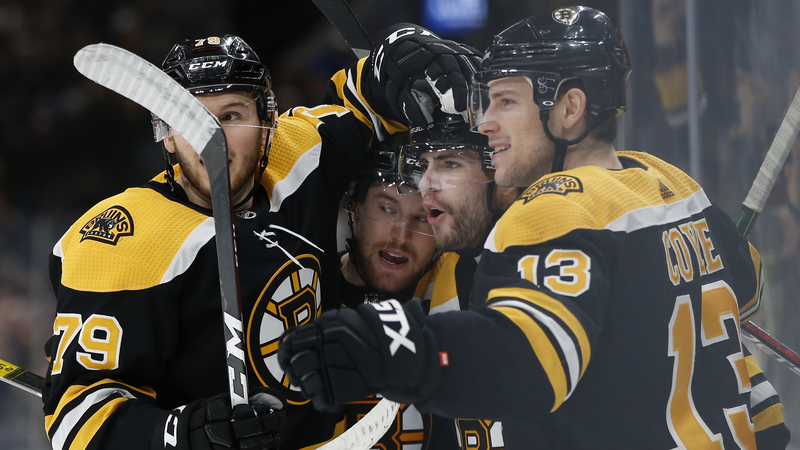 Boston Bruins' Jeremy Lauzon, Matt Grzelcyk, Jake DeBrusk And Charlie Coyle