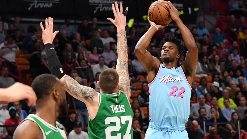 Miami Heat forward Jimmy Butler (22) and Boston Celtics center Daniel Theis (27)