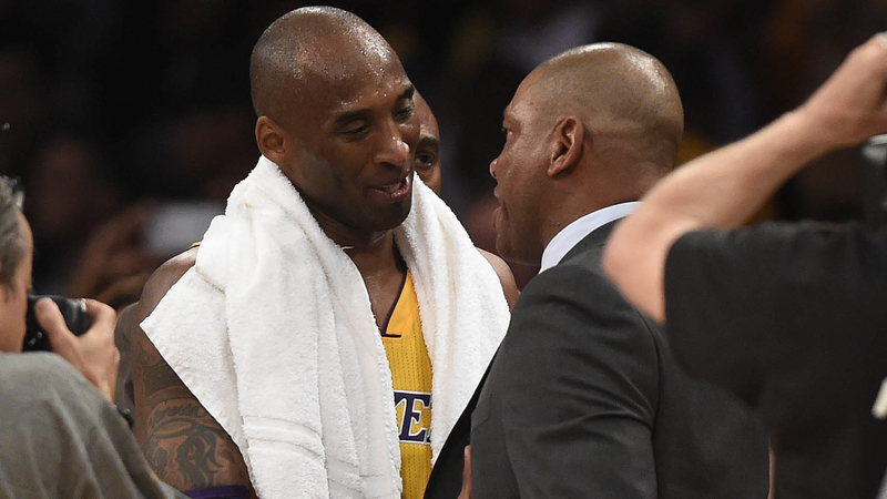 Former Los Angeles Lakers Forward Kobe Bryant And Los Angeles Clippers Head Coach Doc Rivers