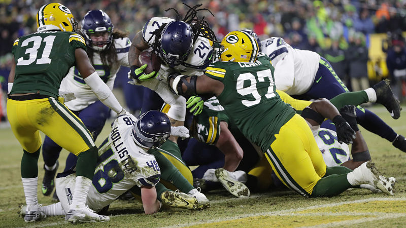 Seattle Seahawks running back Marshawn Lynch and Green Bay Packers defensive lineman Kenny Clark