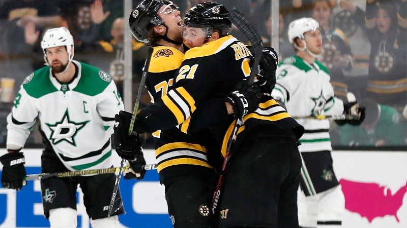 Boston Bruins defenseman Charlie McAvoy (73) and left wing Nick Ritchie (21)