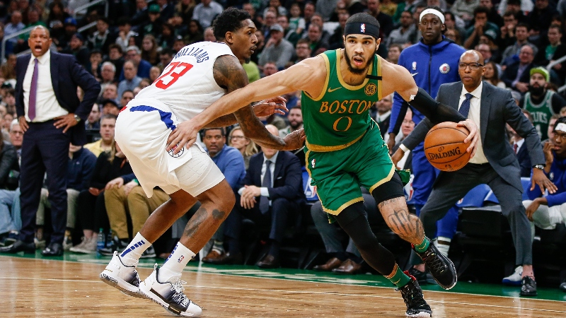 Boston Celtics forward Jayson Tatum (0) and Los Angeles Clippers guard Lou Williams (23)