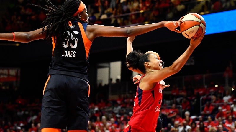 Connecticut Sun forward Jonquel Jones (35) and Washington Mystics guard Kristi Toliver (20)