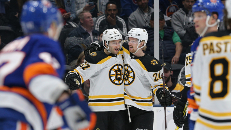 Boston Bruins forwards Patrice Bergeron, Joakim Nordstrom