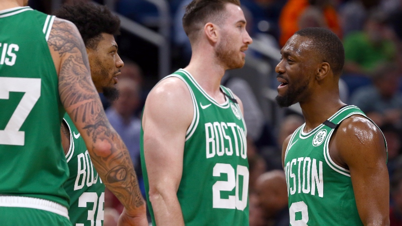 Boston Celtics guards Marcus Smart (left) and Kemba Walker (right) and forward Gordon Hayward (center)